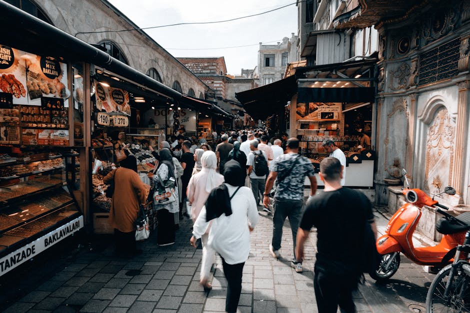 Discover the vibrant atmosphere of an Istanbul market bustling with people and shops.